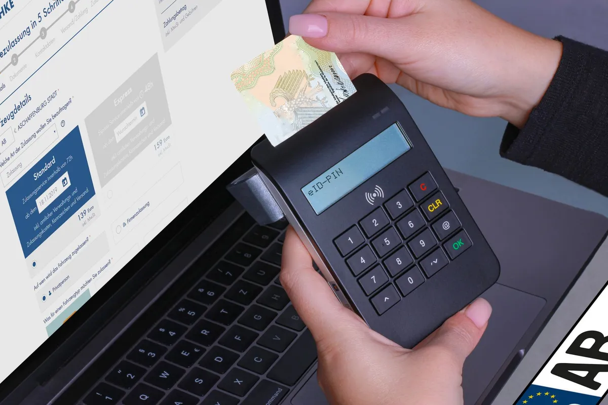 Close-up of a contactless payment using a card reader and laptop, highlighting digital security.